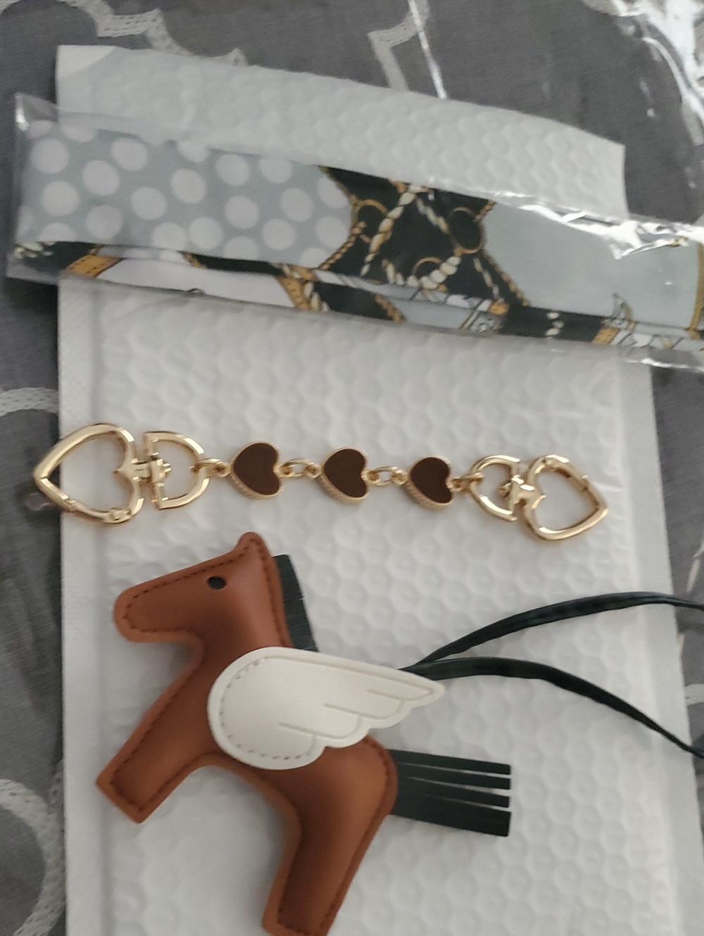 Coach Brown and White Winged Horse Bag Charm with Gold Hearts